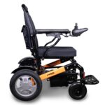 Side view of the EWheels EW-M45 wheelchair in black with orange accents, showcasing its sleek design and color contrast