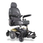 Front side view of the Merits Vision Sport wheelchair in champagne, highlighting its elegant design and comfort features.