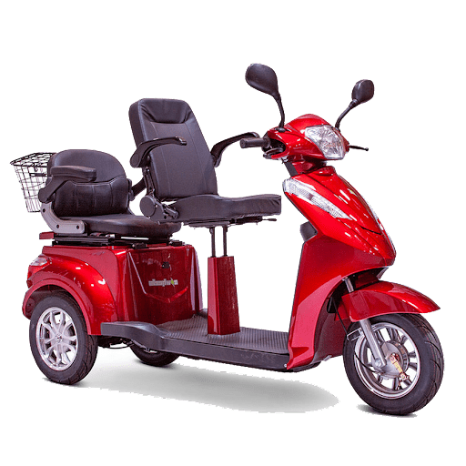 A sleek red mobility scooter with three wheels, a comfortable seat with armrests, and a backseat. It features handlebars with mirrors, a basket on the back, and a small footrest area. The scooter has a modern design suitable for enhanced mobility and convenience.