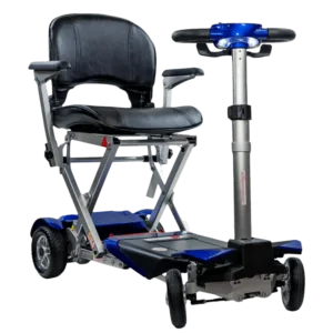 A compact, foldable mobility scooter in blue and black with a cushioned seat and backrest. The scooter features four wheels, a handlebar for steering, a folding mechanism, and LED front lights for visibility.