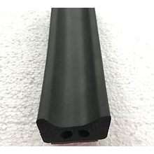 The Scoota Trailer Part Top Seal, a dense black foam piece with a contoured profile and two holes, designed for weatherproofing