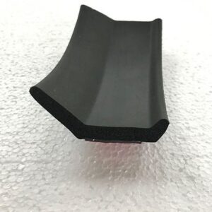 Close-up of the Scoota Trailer Part Wiper Seal, a flexible black rubber strip with a curved edge, designed to form a tight seal