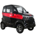A striking red and black electric vehicle by Green Transporter features a glossy finish, highlighting its modern design and sustainable appeal for city driving.