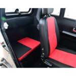 Vibrant red and black bench seat of a Green Transporter Q Express vehicle, designed for comfort and style with secure seatbelts.