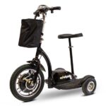 Front view of the EWheels EW-18 Stand-n-Ride scooter in black color, featuring a swivel seat, large treaded front wheel, and a red and black plaid basket on the handlebar