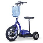 Front view of the EWheels EW-18 Stand-n-Ride scooter in blue color, featuring a swivel seat, large treaded front wheel, and a red and black plaid basket on the handlebar