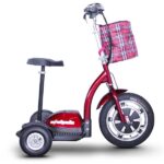 A side angle of the red EWheels EW-18 Stand-n-Ride scooter displaying its large front wheel, sturdy rear wheels, and a fashionable red and black plaid basket attached to the handlebars.