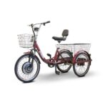 A full view of the EWheels EW-29 electric tricycle in maroon, featuring a comfortable seat, two large white wire baskets, one in the front and one in the back, and a sturdy three-wheel design.