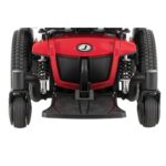 Front view of a Jazzy 600 ES power chair by Pride Mobility, featuring red color panels, black trim, mid-wheel drive with large tires, and advanced suspension system.