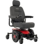 Stylish and vibrant Red color of Pride Mobility Jazzy EVO 613 power wheelchair, equipped with a comfortable high-back seat and user-friendly controls for easy navigation.