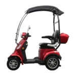 Daymak Roadstar side view in red, showcasing the full frame, cushioned seat, canopy, and rear storage compartment.