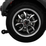 Close-up of the Daymak Roadstar black alloy wheel with silver accents, showing the disc brake system.