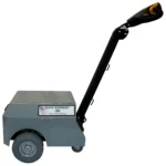 Side view of pony express 1062 electric powered tugger showing gray housing black tiller arm and solid rubber wheels