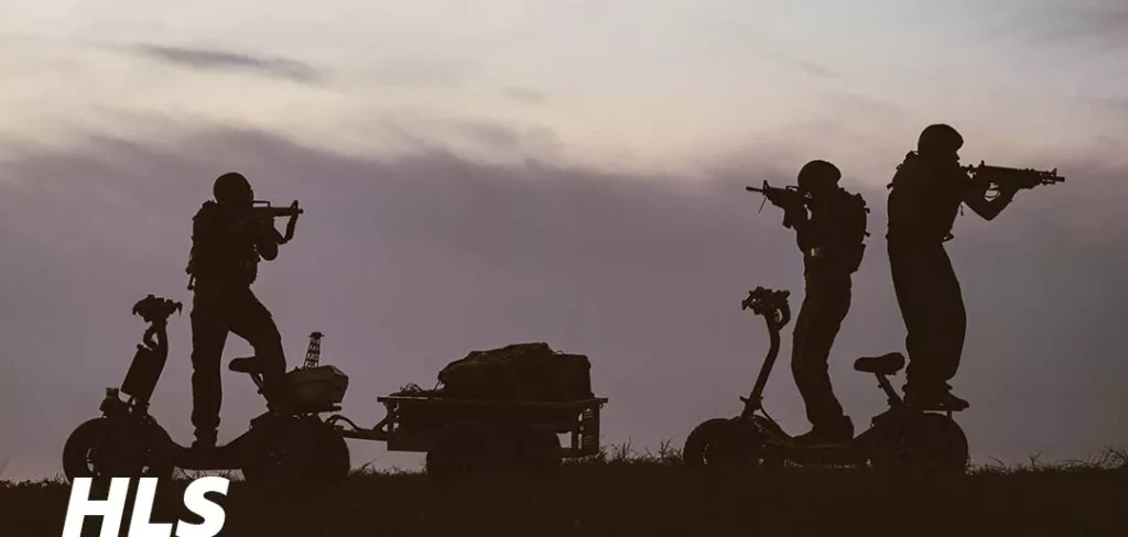 EZRaider HD4 4x4 off-road electric scooter with seat on rocky terrain during sunrise