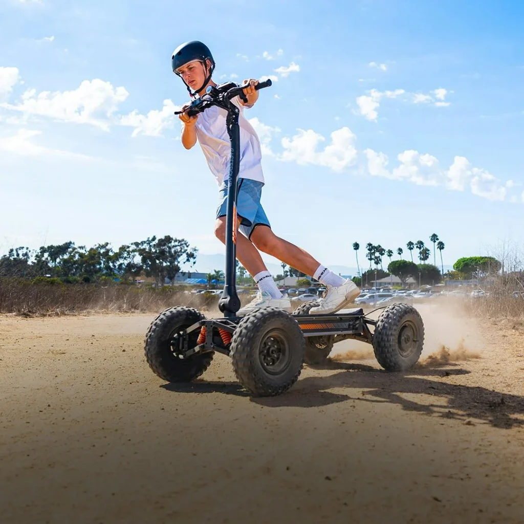 Rider using CycleBoard X-Quad 3000 electric scooter on dirt trail