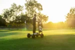 Man riding an off road electric Cycleboard X-Quad 3000 Golf scooter on a golf course explore easy golf course mobility today