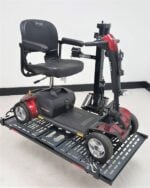 Pride Go Go travel scooter strapped onto the Model 210 platform