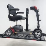 Side view of a mobility scooter secured on the raised US208 electric lift platform
