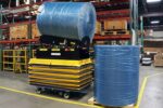 Custom motorized scissor lift cart configured for an aerospace packaging line