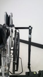 Close up of the Tote Model 003 hold down arm and cam buckle strap on a folded chair