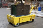 EK Tech custom motorized transfer cart carrying a heavy steel load