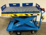 Pony Express ball transfer top with rows of steel ball casters, shown fitted to a Pony Express electric scissor lift cart
