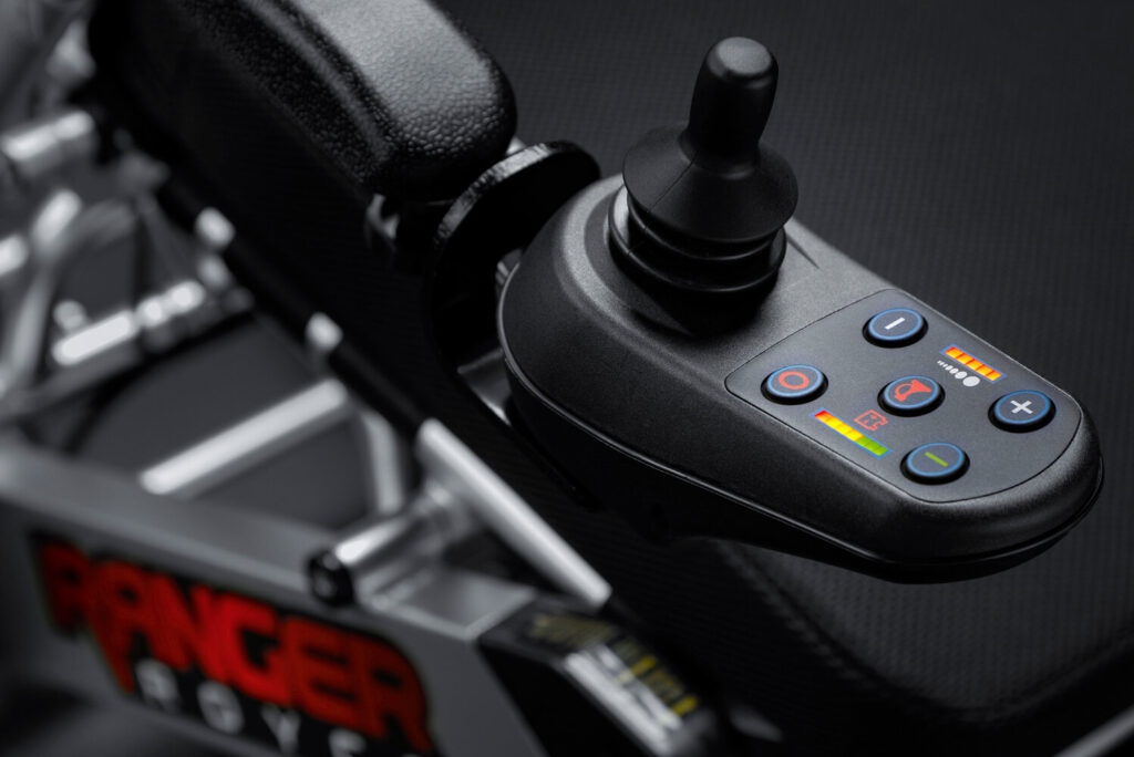 Porto Mobility Ranger Royce folding power wheelchair, joystick control buttons close up