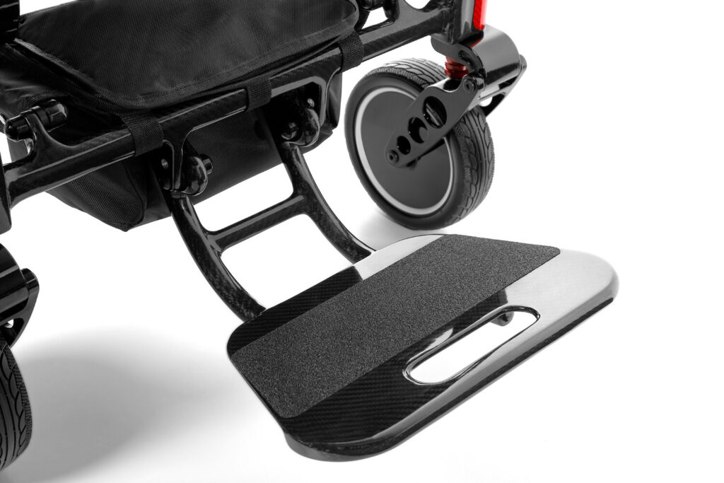 Porto Mobility Ranger SpacePro XL folding power wheelchair, footplate with grip pad close up