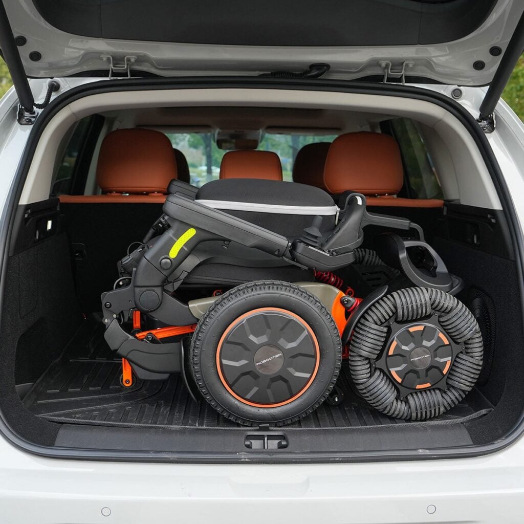 Folded Robooter E60 Pro GT in the cargo area of an SUV